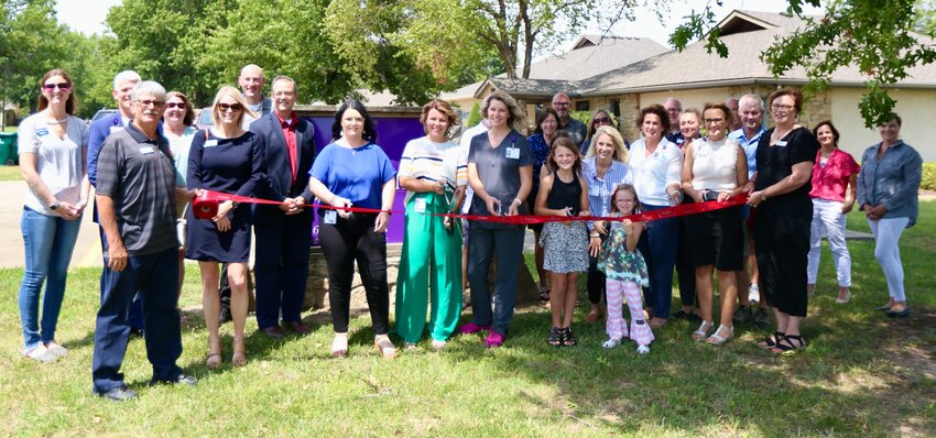Pittsburg Area Chamber of Commerce members, Labette Health representatives as well as their families gather during the ribbon cutting on Wednesday of the new Labette Health Pittsburg Clinic, located at 2309 S. Tucker Terrace.