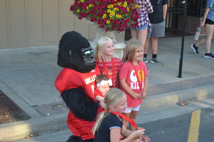 Gus, the area&rsquo;s most popular celebrity, stops to pose with fans during Wednesday&rsquo;s block party in Pittsburg.