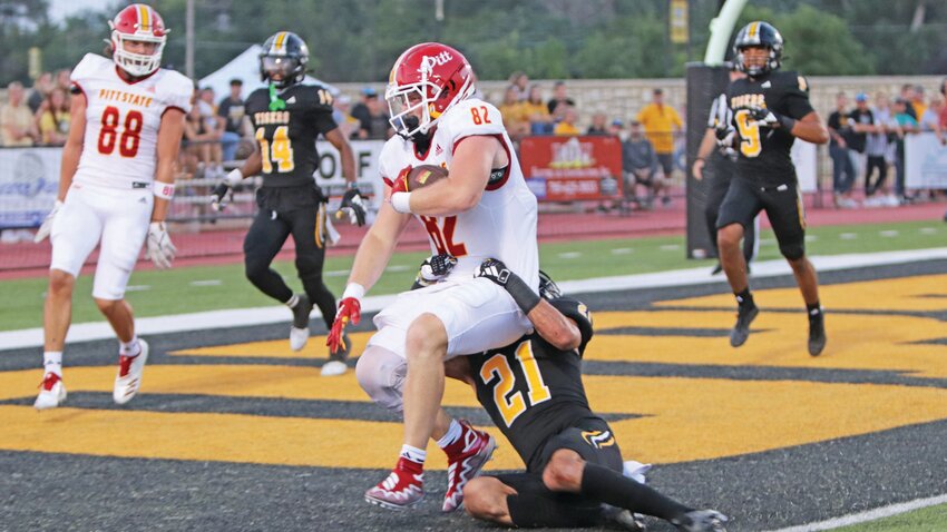 Pittsburg State tight end Dallas Bond scores a touchdown on a nine-yard pass from Chad Dodson in the Gorillas&rsquo; 40-14 victory Thursday night at Fort Hays State.