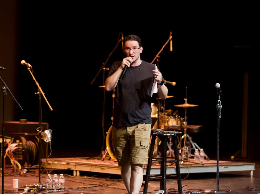 Cody McCully, event organizer and Countryside Christian Youth Minister, delivers the opening remarks in Wednesday&rsquo;s Common Ground Youth Conference at Memorial Auditorium.