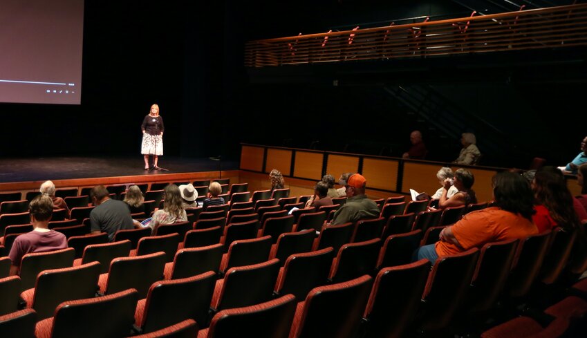 Michelle Niedens, director of the University of Kansas Alzheimer's Disease Center Cognitive Care Network, introduces herself to the crowd at Thursday&rsquo;s showing of Why: A film about dementia, held at the Bicknell Family Center for the Arts on the campus of Pittsburg State University.