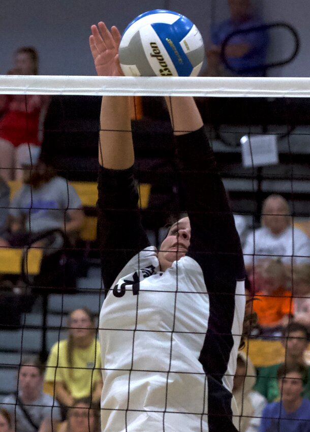 Frontenac senior Aubree Moore goes for a block during Saturday&rsquo;s championship match against Louisburg at Frontenac High School.