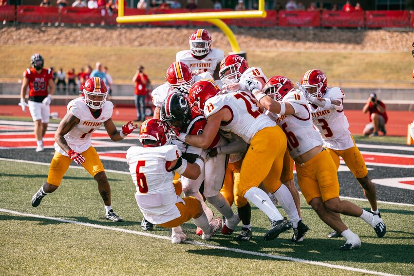 A host of Pittsburg State defenders, including Alex Gaskill (6), Zach Coenen (23), Ryan Medeiros (16), Jack Barkley (40) and Jaylen Fuksa (3), combine to stop Central Missouri&rsquo;s Marcellous Hawkins on a 2-point conversion run in the last minute of last Saturday&rsquo;s 38-37 victory over the Mules.