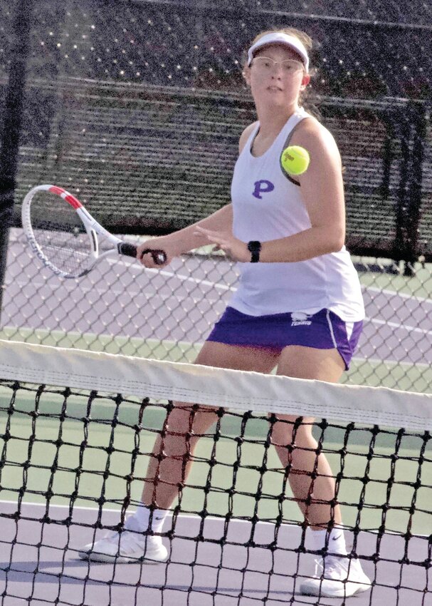 Pittsburg&rsquo;s Indiana Grotheer, part of the  No. 1 doubles team, makes a return during a match Thursday at the Pittsburg High School Tennis Courts.