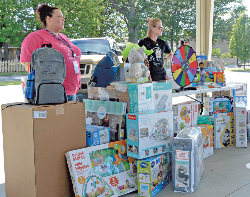 Working their way around the various tables at Tuesday&rsquo;s Crawford County Community Baby Shower, attendees had the opportunity to fill out a passport at each station for the opportunity to win various prizes for children. Prizes included a portable swing, Tummy Time Pillow, activity gym, dreams soother, baby bather and foldable booster. Aetna, a health care company, also donated $1,000 for event coordinators to spend on prizes for the event.