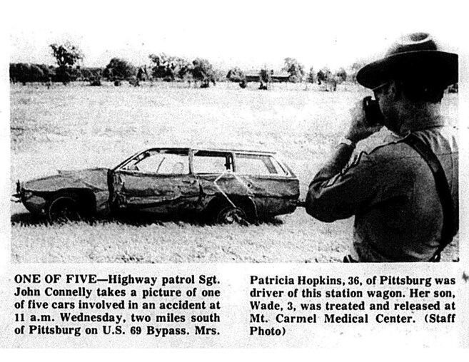 ONE OF FIVE&mdash;Highway patrol Sgt. John Connelly takes a picture of one of five cars involved in an accident at 11 a.m. Wednesday, two miles south of Pittsburg. Mrs. Patricia Hopkins, 36, of Pittsburg was the driver of this station wagon. Her son, Wade, 3, was treated and released at Mt. Carmel Medical Center.
