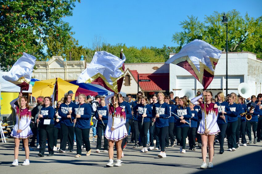 The Girard High School flag and cheer team parade through the downtown streets of Girard during this year&rsquo;s Girard Fall Festival parade, which featured local businesses, organizations, emergency services and alumni, along with grand marshal Tim Geier.