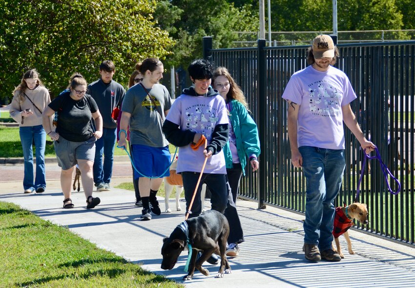 Dog lovers from across the Pittsburg area gathered at Schlanger Park in Pittsburg on Saturday for the annual Bark in the Park. During the afternoon, attendees walked through the park with their animals for the community dog walk.