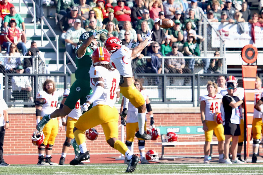 Pittsburg State's Jaylen Fuksa breaks up a pass intended for Northwest Missouri's Trevon Alexander in front of Mike Lacey during Saturday afternoon's game in Maryville, Mo.
