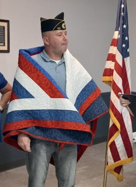 Army Master Sergeant Marc McCully received his Quilt of Valor Wednesday last at the Frontenac American Legion Post 43. McCully has served nearly 30 years in the Kansas National Guard, including a tour in Iraq in 2005.&nbsp;
