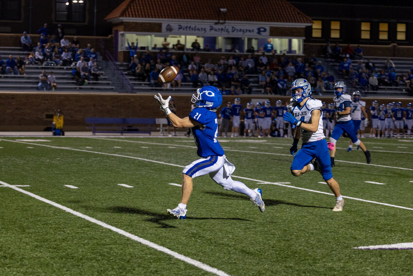 St. Mary's Colgan's Klayton Adamson catches a touchdown pass from Tucker Harrell on Thursday night during the Panthers' 68-13 victory over Pleasanton in a Class 1A playoff game at Hutchinson Field.