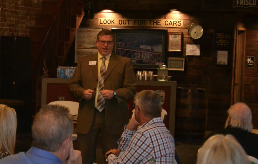 Spencer Duncan, the government affairs director for the League of Kansas Municipalities, speaks with mayors, commissioners, and council members from several cities across southeast Kansas about the upcoming legislative session in Topeka.