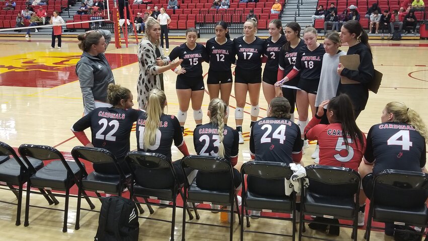 William Jewell volleyball coach Samantha Williams discusses strategy with her team during Tuesday night's match at Pittsburg State.
