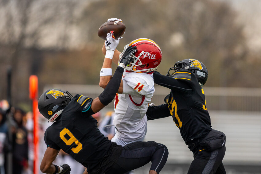 Pittsburg State's Kolbe Katsis makes the catch between two Missouri Western defenders during Saturday's game in St. Joseph, Mo.