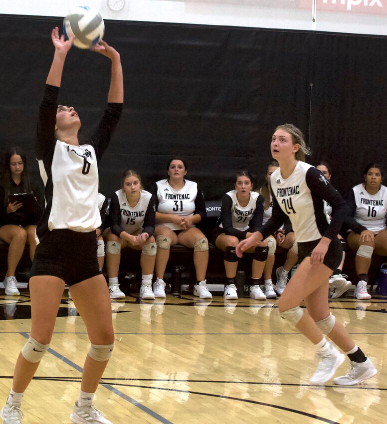 Frontenac sophomore Lucy Anderson (24) eyes a set from teammate Kendl Matlock before she hits a kill during the Radiers' home tournament on Sept. 9