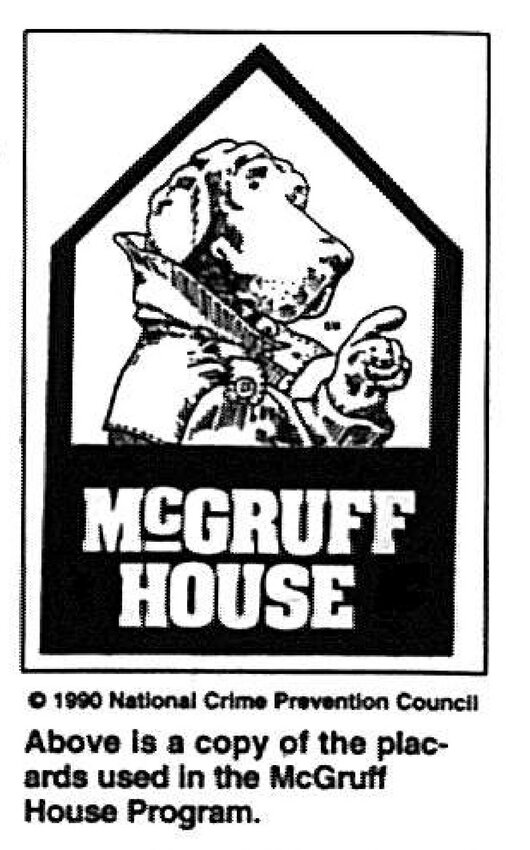 A sign with McGruff the Crime Dog in the window shows those in need that the house is a safe place.