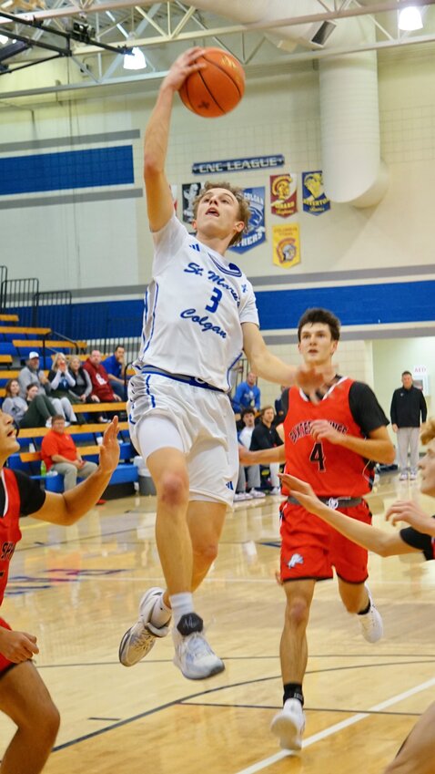 St. Mary's Colgan senior Jack Schremmer scores a layup in the second half against Baxter Springs.