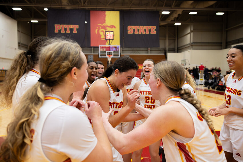Alba Lozano (center) and her teammates are all smiles after Pittsburg State beats Nebraska-Kearney 83-67 on Jan. 11 at John Lance Arena.