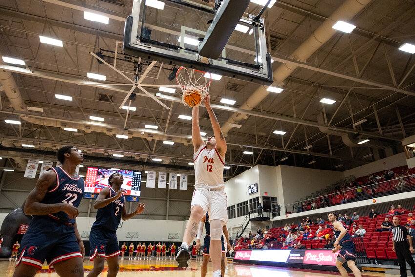 Pittsburg State sophomore center Tane Prictor throws down a dunk in Wednesday's game against Rogers State at John Lance Arena