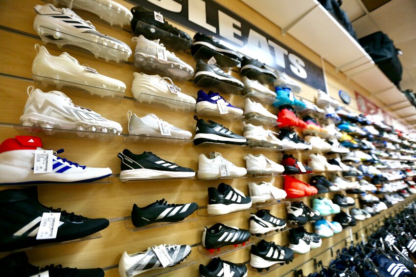 Adidas soccer and baseball cleats, and basketball shoes make a colorful display at Jock&rsquo;s Nitch Sports located in downtown Pittsburg. The local business has collaborated with the Community Foundation of Southeast Kansas and USD 250 to provide athletic shoes for Pittsburg High School student athletes facing difficulty in securing proper equipment.