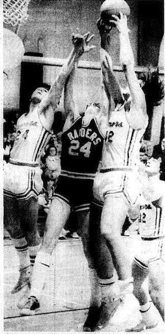 BOARD CONTROL &mdash; Stan Pierson (white, 42) takes a rebound out of the hands of Frontenac&rsquo;s Robert Grilz while Southeast teammate Chuck Poznich (24) tries for a piece of the carom and Jay Brazed (32) awaits results. Southeast downed Frontenac 64-52.&nbsp;