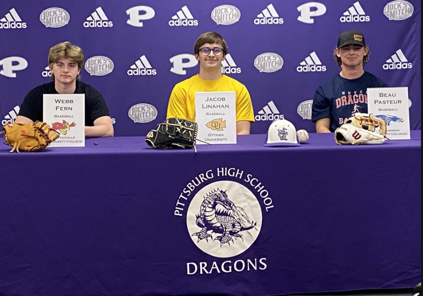 Webb Fern, Jacob Linahan and Beau Pasteur pose before signing on Wednesday at Pittsburg High Schoool