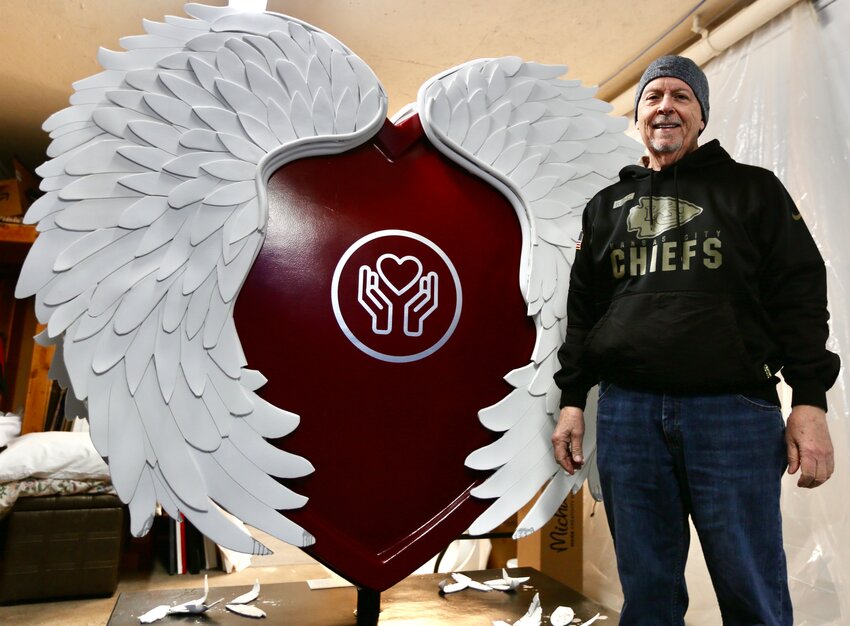 Lynn Meredith, a Pittsburg resident, stands proudly beside his creation for this year&rsquo;s &ldquo;Parade of Hearts,&rdquo; which will be placed somewhere within the Kansas City region.