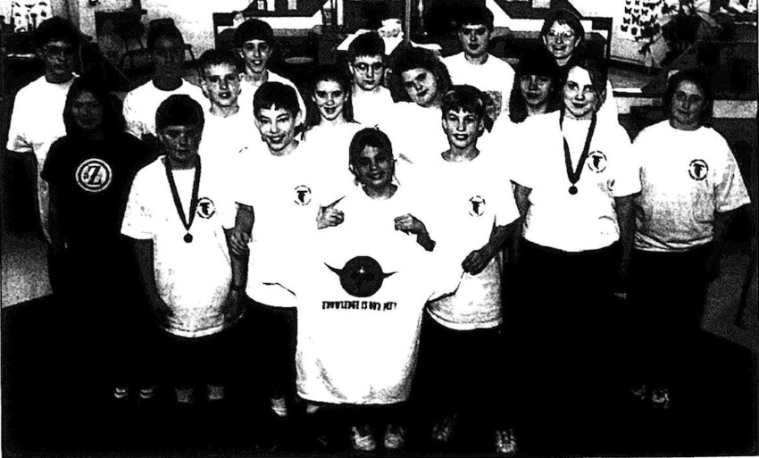 Pittsburg Middle School students who competed in the Science Olympiad Regional tournament in 1999 are, from left to right: (first row) Eddi Penner, Kale Garner, Adam Ward, Jesse Niobium, Lucy Miller-Downing, (second row) T. J. Mullein, Jerrad Mitchell, Jesse Mitchell, Pam Stoltsen burg, Sara Simpson, Tyana Deck, (third row) Jeremy Johnson, Kevin Harris, Cooper Neil, Chris Norris, Clay Adair and Mrs. Pam Baldridge. Not pictured: Gene Roundtree and Britney Wydick