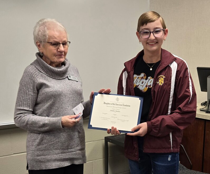 Regent Janie Fletcher names Emijlle Hanks, an 8th grader at Girard, the winner of the American History Essay Contest sponsored by the Oceanus Hopkins Chapter of the Daughters of the American Revolution (DAR) in Pittsburg on Monday night.