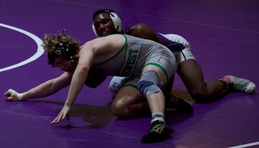 Pittsburg sophomore De&rsquo;Marus Partee wrestles against Blue Valley Southwest&rsquo;s Tad Forsyth in their 175-pound Class 5A East regional final match Feb. 18 at Pittsburg High School. BROCK SISNEY / THE MORNING SUN