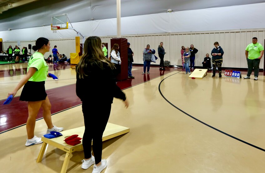 Girard High School volunteers and Special Olympics Kansas Southeast Region athletes toss the bags during a game of cornhole during Wednesday&rsquo;s Southeast Unified Cornhole competition held at the Girard Activity Center.