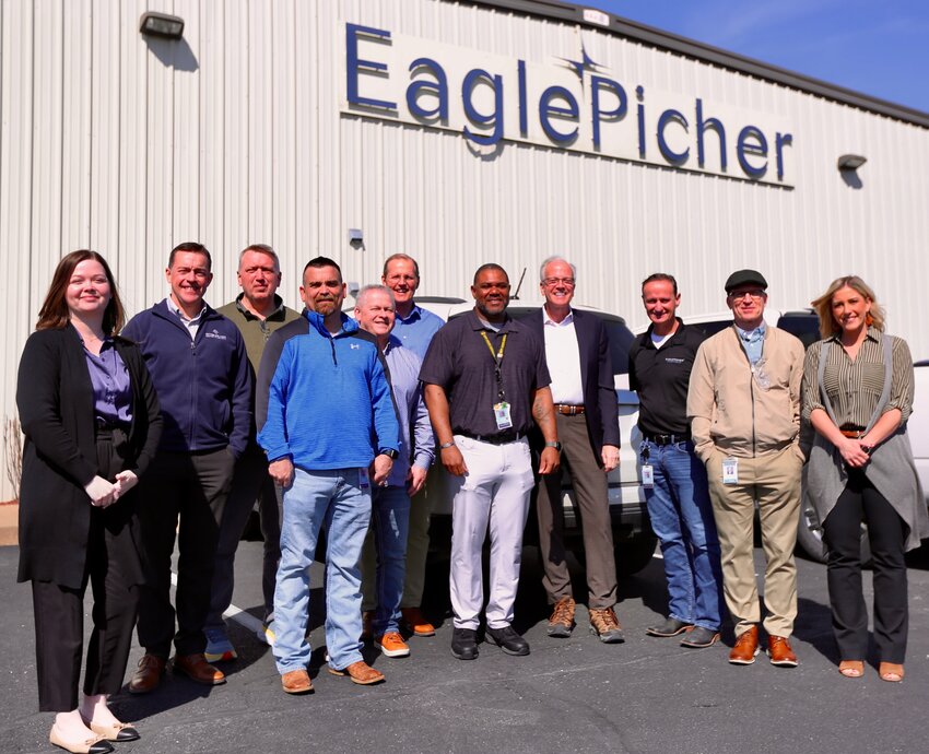 EaglePicher Technologies and city of Pittsburg representatives gather for a photo in front of the facility following Senator Jerry Moran&rsquo;s tour on Thursday. From left are Sarah Runyon, Blake Benson, Steven Westfall, Shannon Baker, Ron Nowlin, Daron Hall, Michael Rogers, Jerry Moran, Claude Merriman, Jay Byers, and Kim Froman.