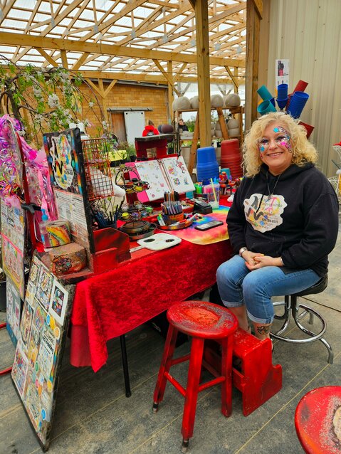 Angela Swift, owner of Artistic Impressions by Angela, travels the area bringing the joy of art to festivals, concerts, and birthday parties.