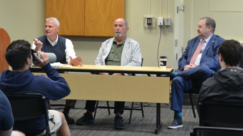 State Representatives Chuck Smith and Ken Collins, along with State Senator Tim Schalllenburger&nbsp; discuss the inner workings of the state legislature with high school seniors from across Crawford County.