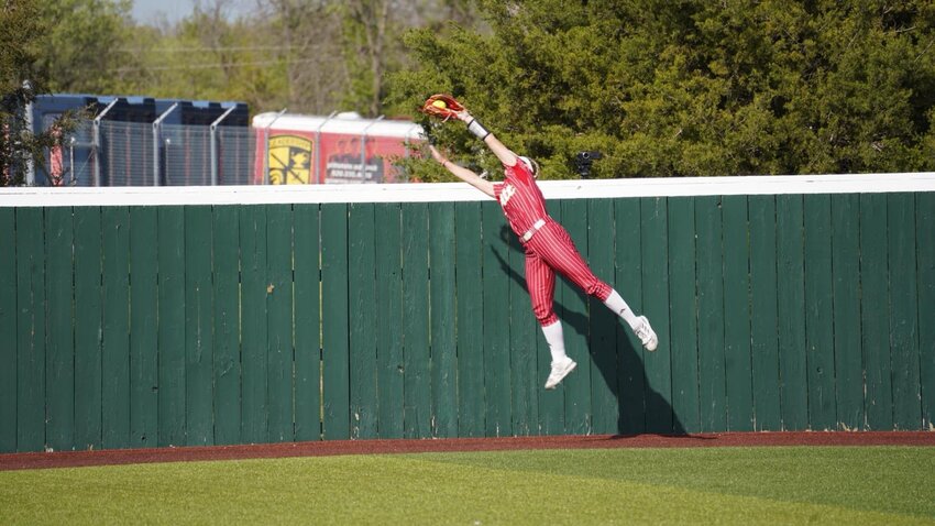 Pittsburg State center fielder Heather Arnett makes the catch to rob MIssouri Southern's Maddie Rolfs of a three-run home run last Saturday at the PSU Softball Complex.