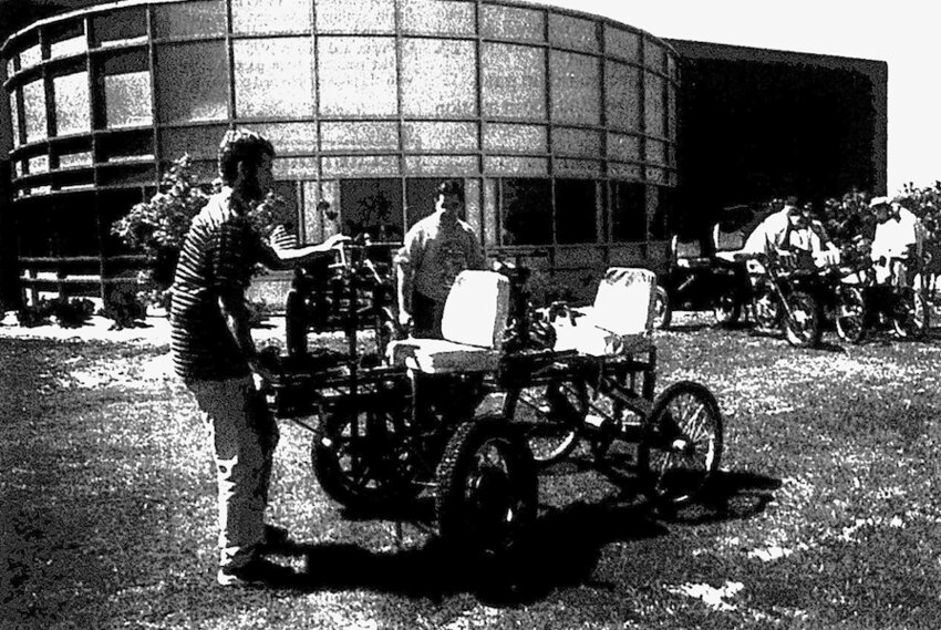 Eddie Collins, left, and Charles Glaser ready the moon buggy for testing at the Kansas Technology Center on the Pittsburg State campus.