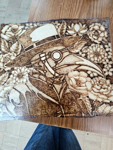 Ms. Denham is focusing on wood burning art with such pieces as this steampunk inspired art.&nbsp;