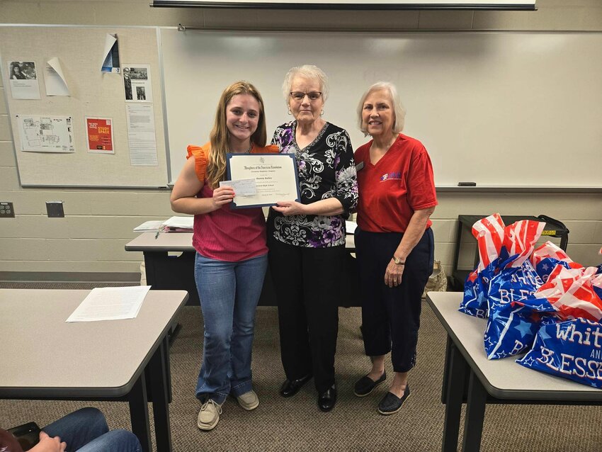 Oceanus Hopkins Regent Janie Fletcher and Treasurer Lynne Erdman present Hanna Bailey with a DAR Good Citizen Award Certificate, pin and a $100 check at the DAR&rsquo;s monthly meeting at Pittsburg State.