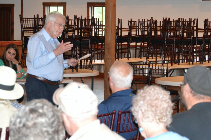 Chicopee resident Jerry Lomshek shares travel data with those gathered at a meeting of the SEK Highway 69 Strategic Alliance at The Barn on Tuesday night. The Alliance&rsquo;s goal is to convince KDOT to expand and improve the US-69 corridor along its existing route.