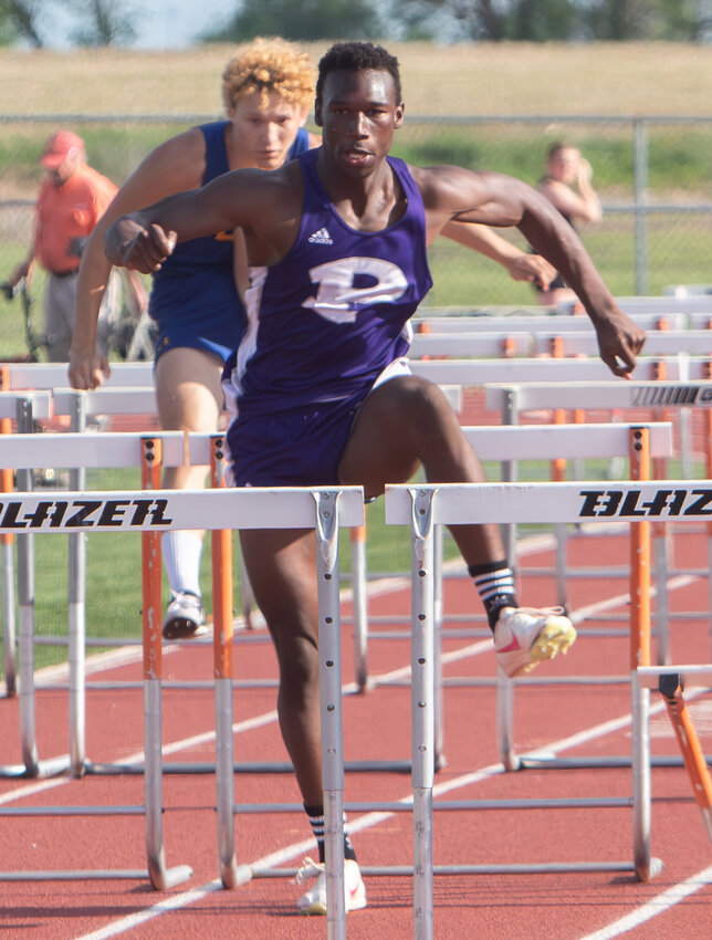 Pittsburg sophomore De&rsquo;Marus Partee clears a hurdle last Friday in the Thad Clements Invitational at Chanute.