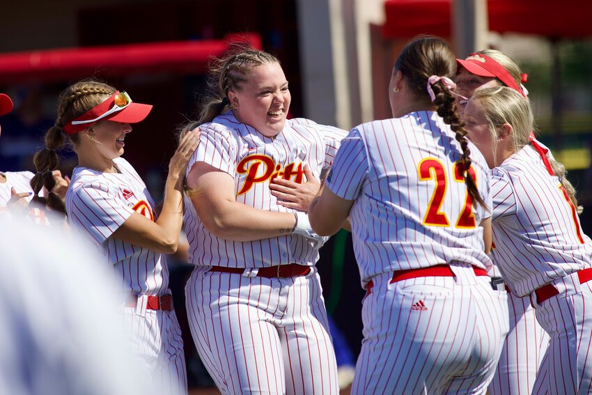 Pittsburg State's Paxtyn Hayes is surrounded by teammates after her seventh-inning single lifted the Gorillas past Southern Arkansas 4-3 on Thursday afternoon at the PSU Softball Complex.