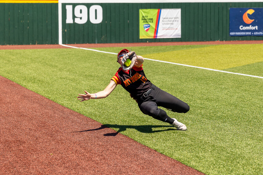 Pittsburg State left fielder Sophia Driver makes a sliding catch to retire Augustana's Liz Dierks in the fifth inning of Saturday's Central Region sub-regional championship game at the PSU Softball Complex.