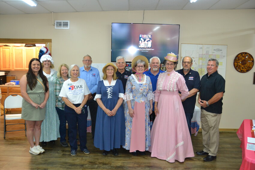 Pittsburg Mayor Stu Hite, far right, poses with members of the local chapters of the Sons and Daughters of the American Revolution (SAR and DAR respectively) while visiting the Crawford County Historical Museum to officially open the Revolutionary War Exhibit sponsored by the Oceanus Hopkins Chapter of the DAR and the Little Balkans Chapter of the SAR. Mayor Hite himself is a longtime member of the SAR, along with his brothers, nephews, and sons, thanks to the efforts of his mother many years ago.&nbsp;