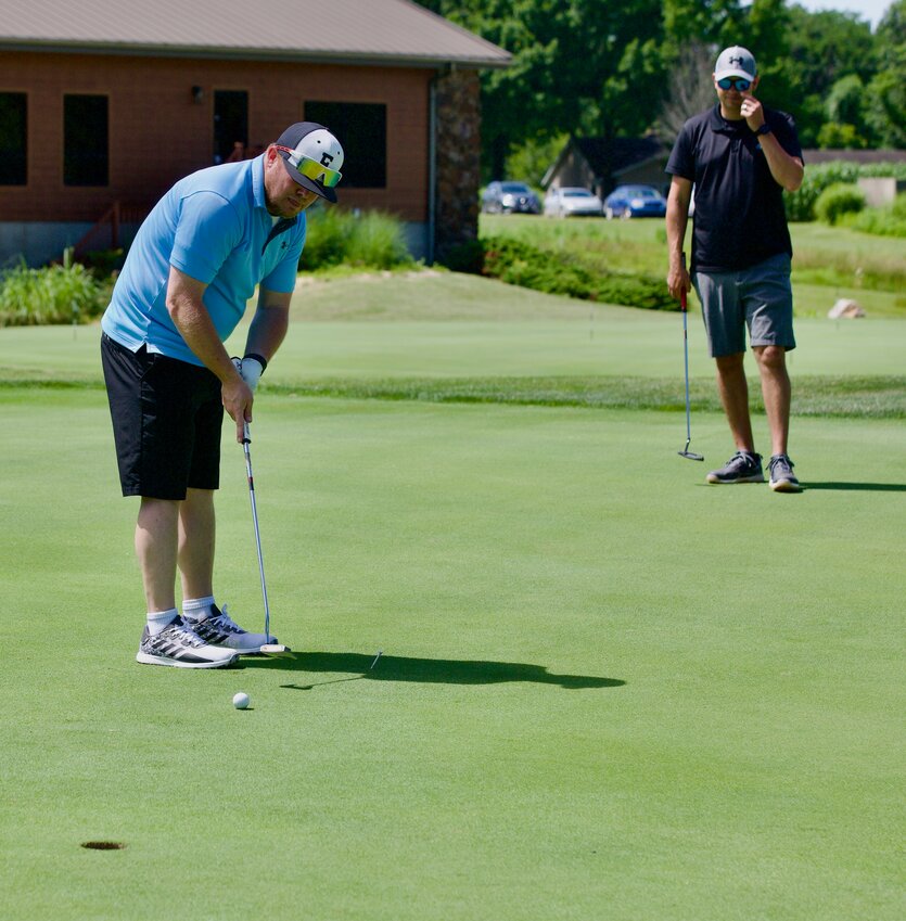 Louie Weimer sinks a putt on the 18th hole at Crestwood Country Club during the morning session of Friday&rsquo;s Pittsburg Area Chamber of Commerce&rsquo;s annual Chamber Foundation Golf Classic.