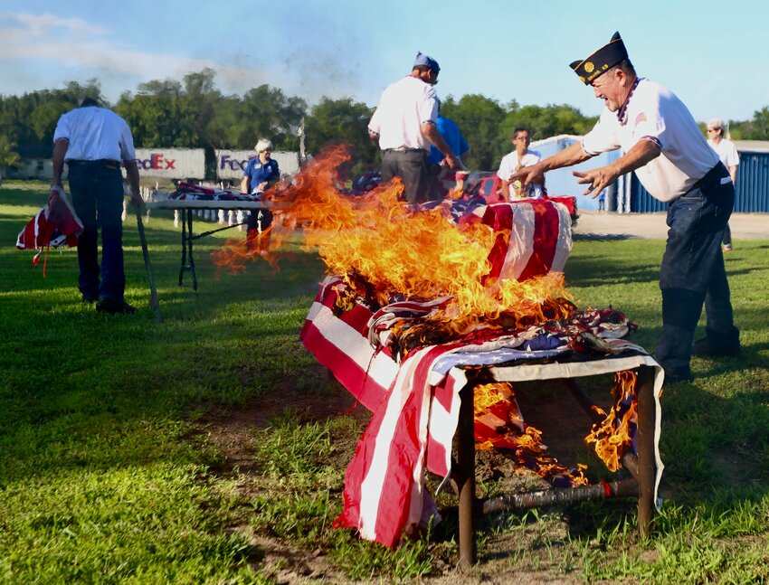 In honor of Flag Day, the George C. Brown American Legion Post No. 26 conducted a flag burning ceremony at its location in Girard. During the ceremony, Post 26 members Dan Cole, Jeff Southard and Rich Francis took the flags and placed them along a metal bench for burning. As per the United States Flag Code, worn flags must be retired and disposed of in a dignified manner. Legion members gathered alongside the local Girl Scouts troop, the Oceanus Hopkins Chapter of the Daughters of the American Revolution, and the Little Balkans Chapter of the Sons of the American Revolution to retire the tattered flags.