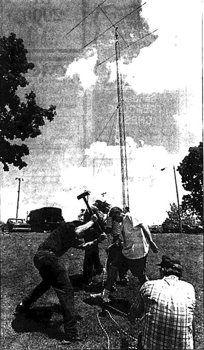 Members of the Pittsburg Repeater Organization work to secure a field radio communication station antenna.