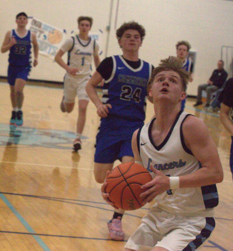 Southeast senior Colten Jameson scores two of his 16 points Monday night against Commerce, Okla. BROCK SISNEY / THE MORNING SUN