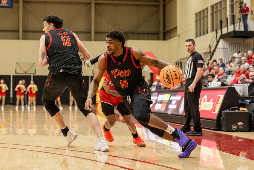 Pittsburg State guard R.J. Forney drives toward the basket after receiving a screen from Tane Prictor during Saturday's game against Central Missouri at John Lance Arena. COURTESY DEREK LIVINGSTON / PSU SPORTS INFORMATION DEPARTMENT