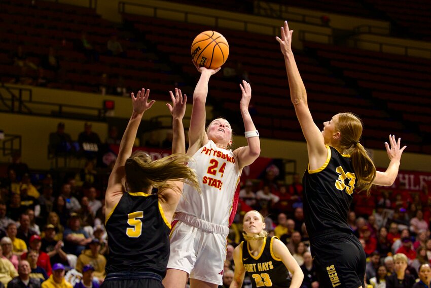 Pittsburg State's Grace Pyle shoots over Fort Hays State's Brooke Loewe (5) and Olivia Hollenbeck (33) in last Sunday's championship game of the MIAA Postseason Tournament in Kansas City, Mo.