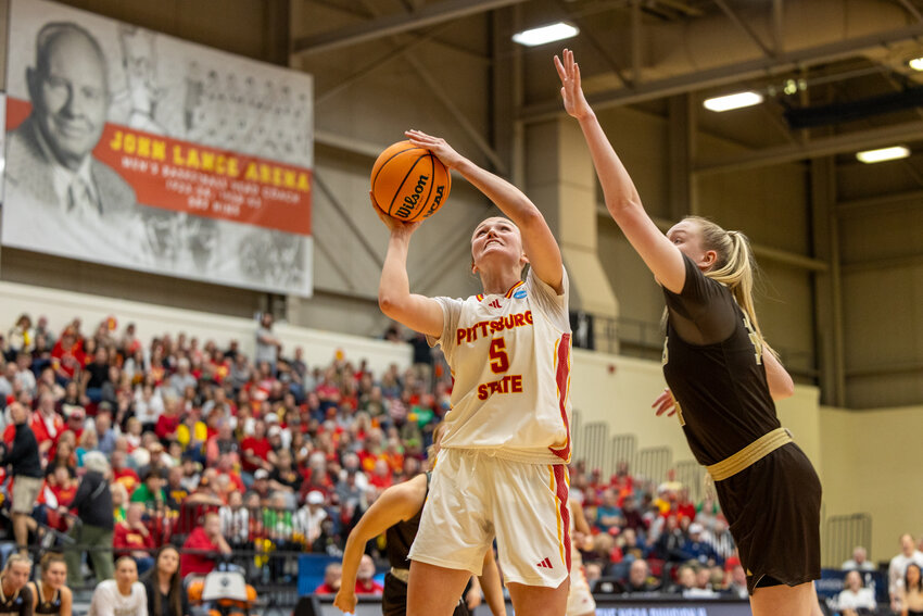Pittsburg State's Karenna Gerber goes up for two of her 34 points in Monday night's 85-82 victory over Southwest Minnesota State in the Central Region championship game at John Lance Arena. Gerber was named the tournament's most outstanding player.